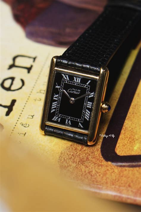 cartier tank black dial.